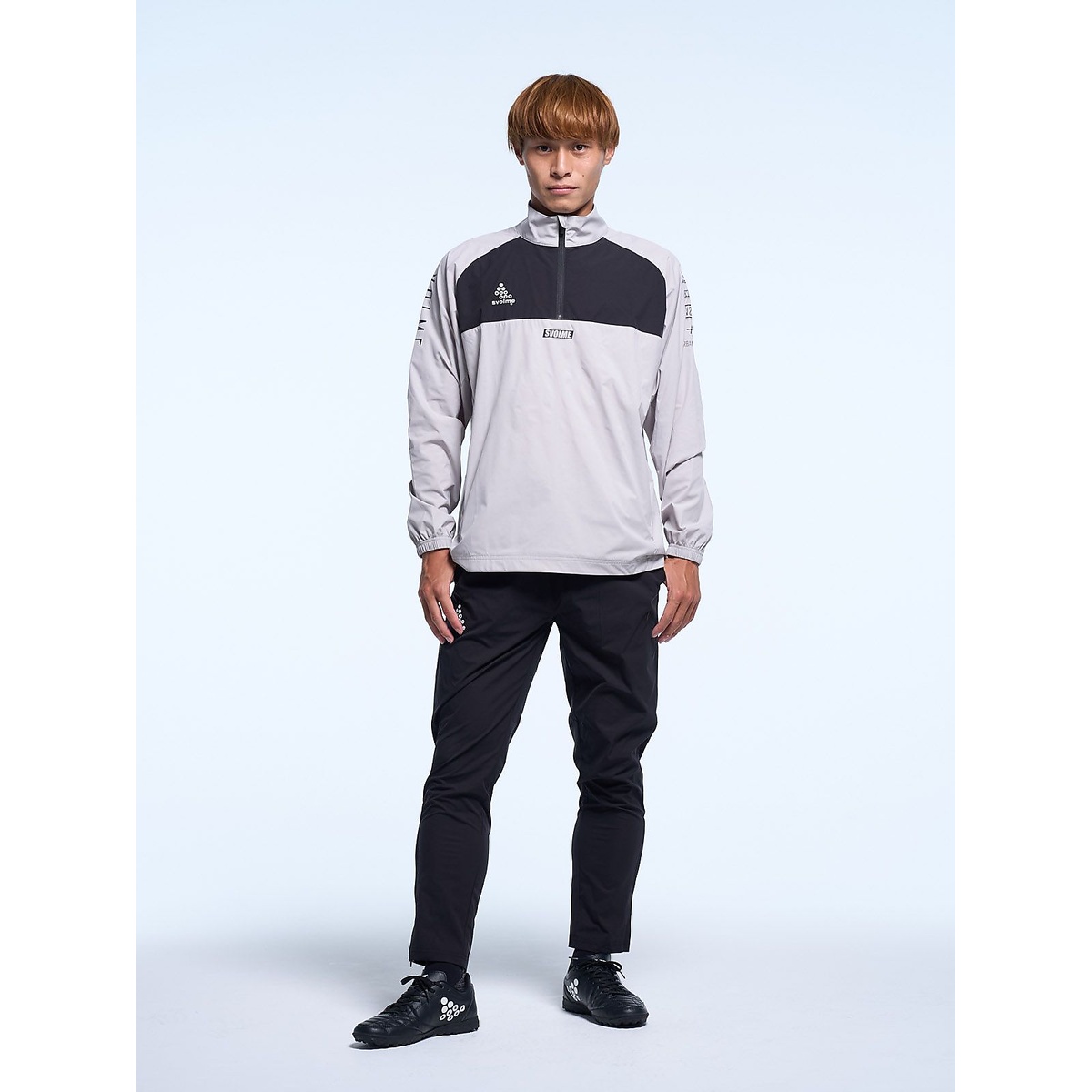 ハーフジップピステトップ